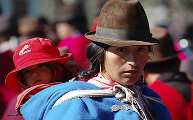 Woman in a traditional Latin America attire with her child