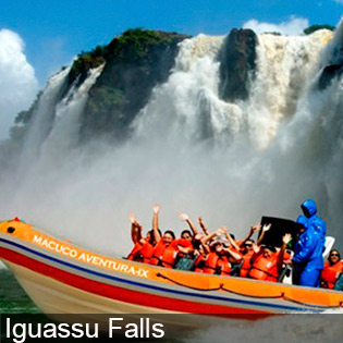 Tourists enjoying a boat ride below the Iguazu Falls