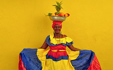 Woman dancing in traditional attire in Colombia