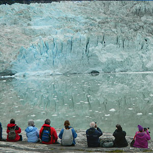 Tourists enjoying the view of a mammoth glacier