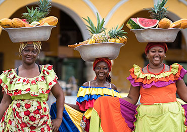 Smiling women in traditional Latin American attire