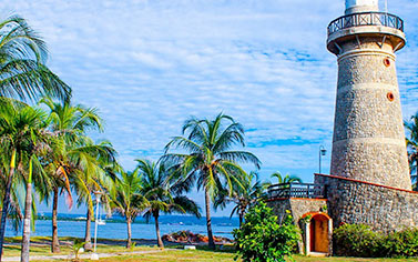 A lighthouse adorns the beautiful beach area